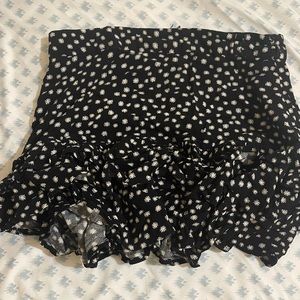 Black daisy zip up shorts